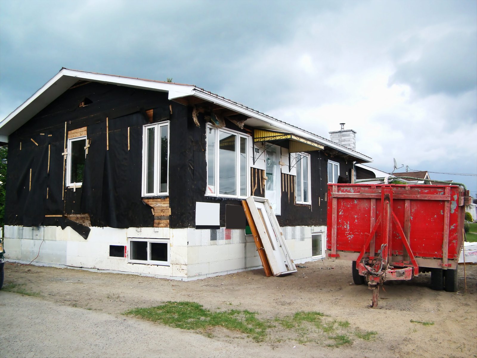 Sell a house needing repairs — close-up of worn house siding needing repair