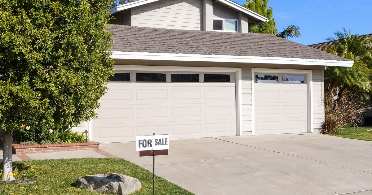 Single-family home with a For Sale sign in Southern California